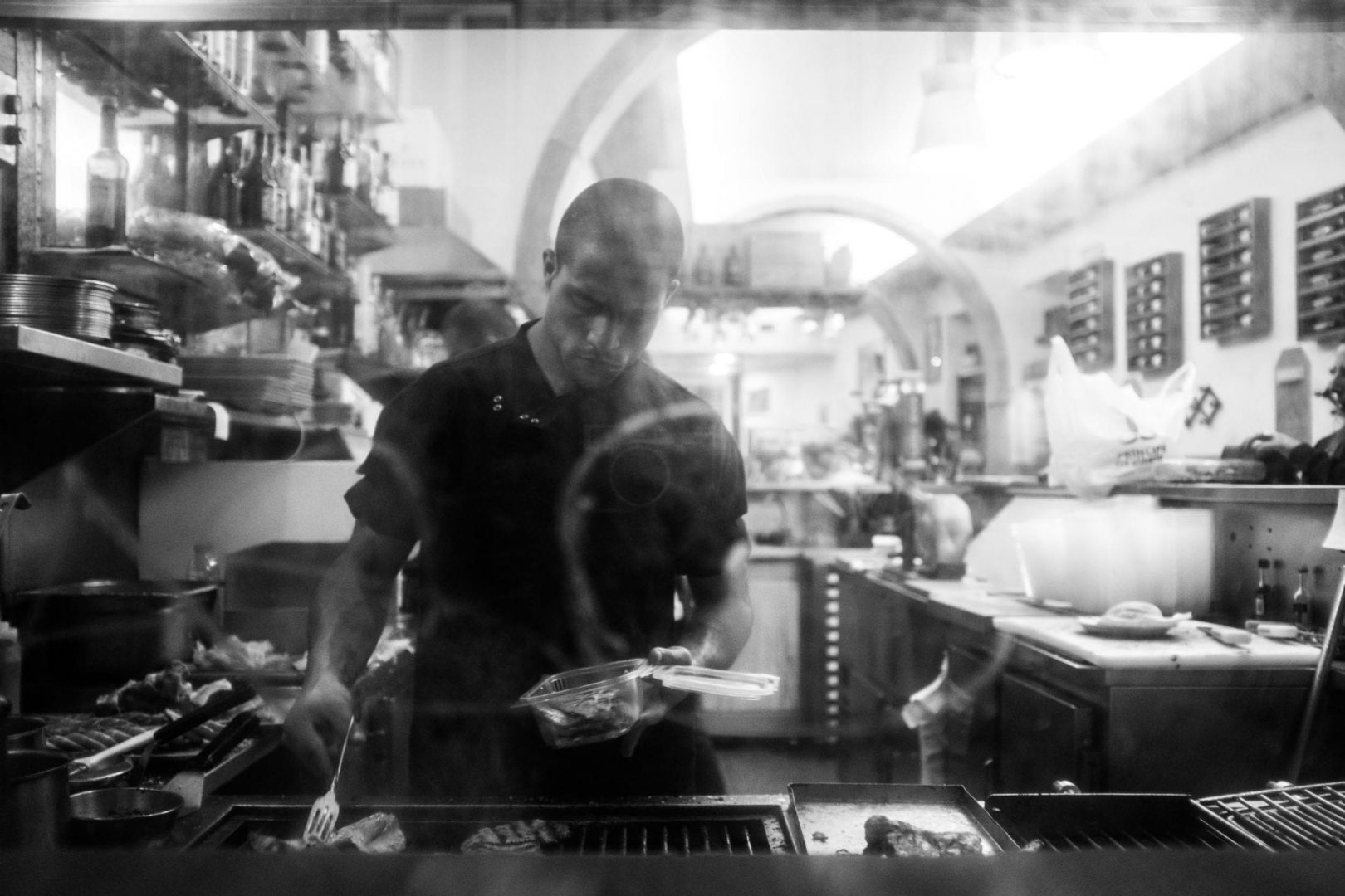 Window shot of a restaurant. The Fujifilm X100F is so discreet that this guy didn't even spot that I was taking him a picture. 